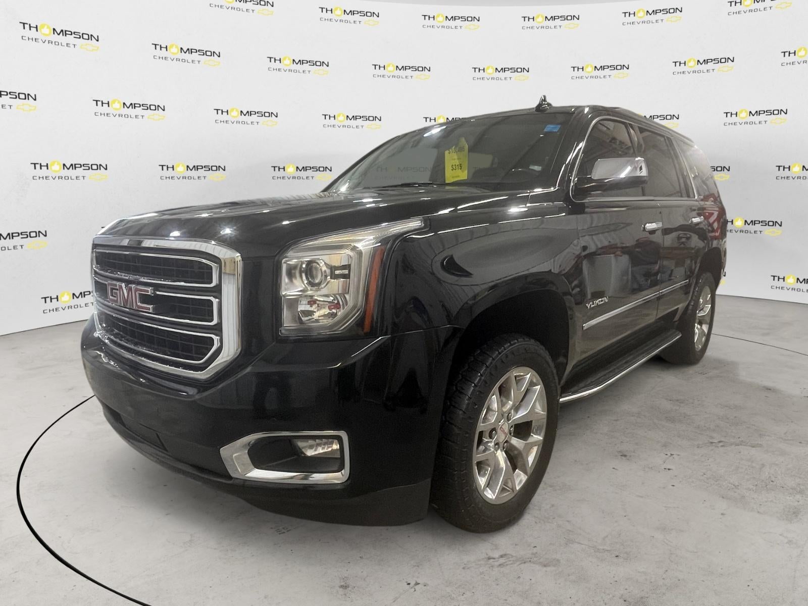 2016 GMC Yukon SLE in Onyx Black — front three-quarter view
