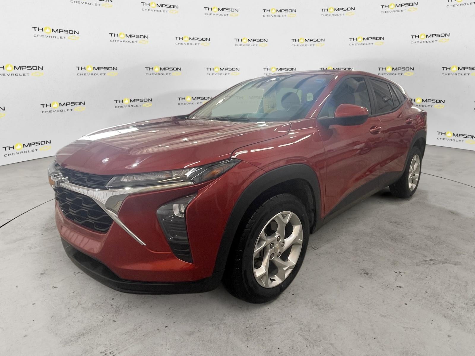 2024 Chevrolet Trax LS in Cayenne Orange Metallic — front three-quarter view
